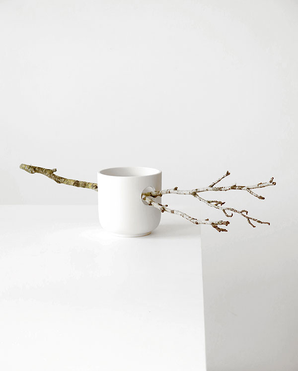 Ceramic bowls with branches by Martín Azúa