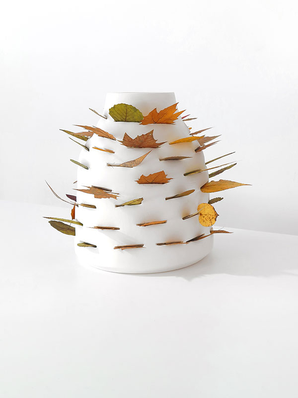 Ceramic vases with leaves by Martín Azúa