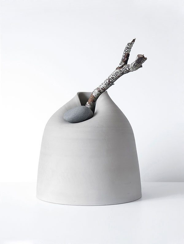 The ceramic vases with stones and branches by Martín Azúa